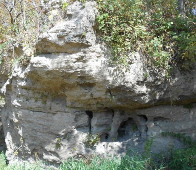 There are many outcrops of rocks pitted with holes. This one is prominent along the path.