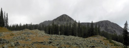 The trail opened up, showing more of the surrounding peaks.